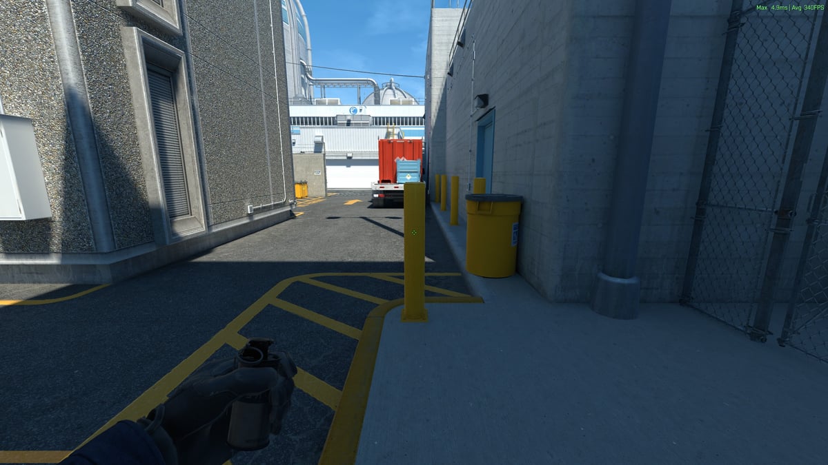 The player showing where to stand to throw the front main smoke on Nuke