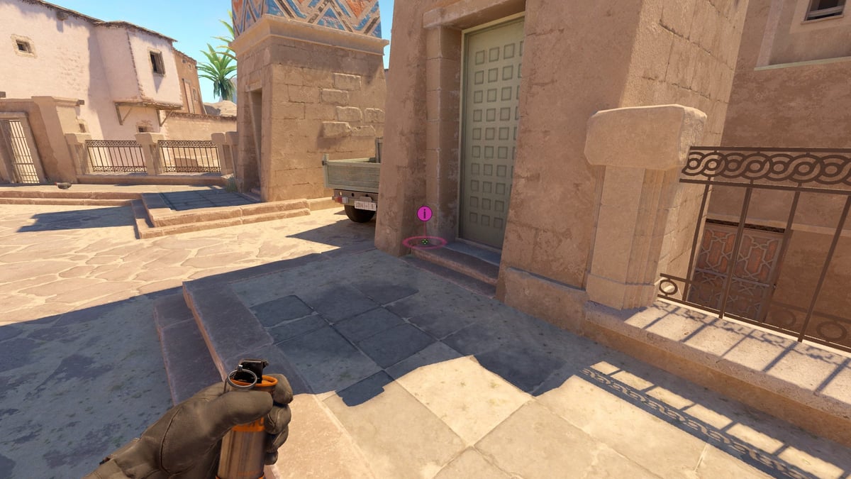 A screenshot of the player showing where to stand to throw the mid smoke on Anubis