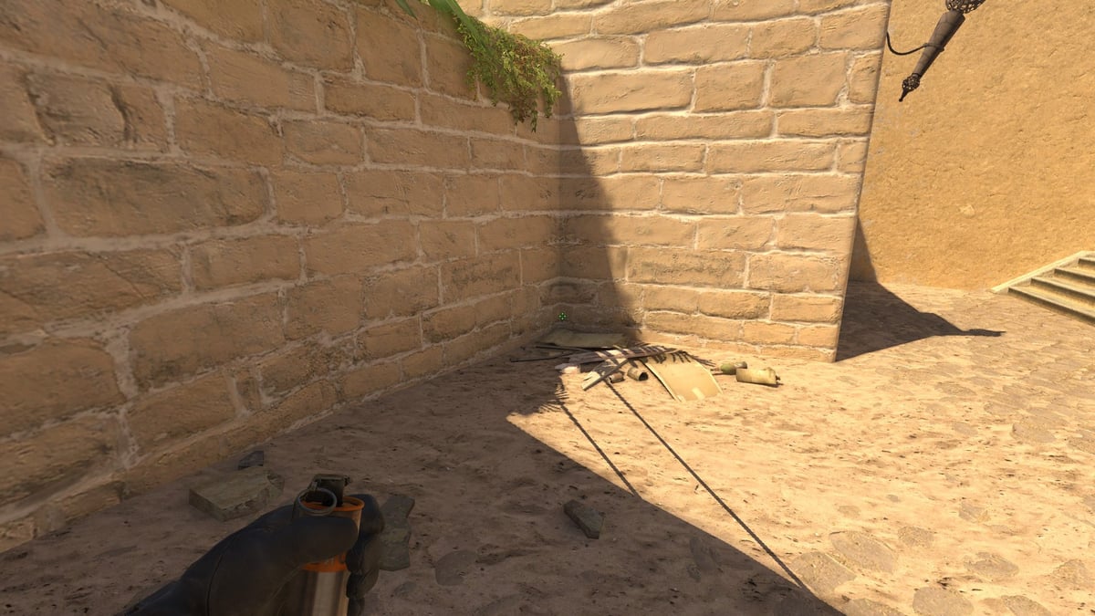 The player showing where to stand to throw the connector smoke on Mirage