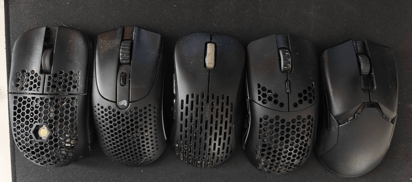 A photo of 4 mice in a row on a mouse pad