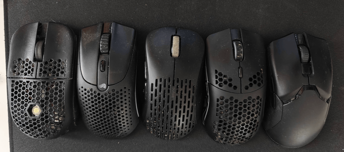 A photo of 4 mice in a row on a mouse pad