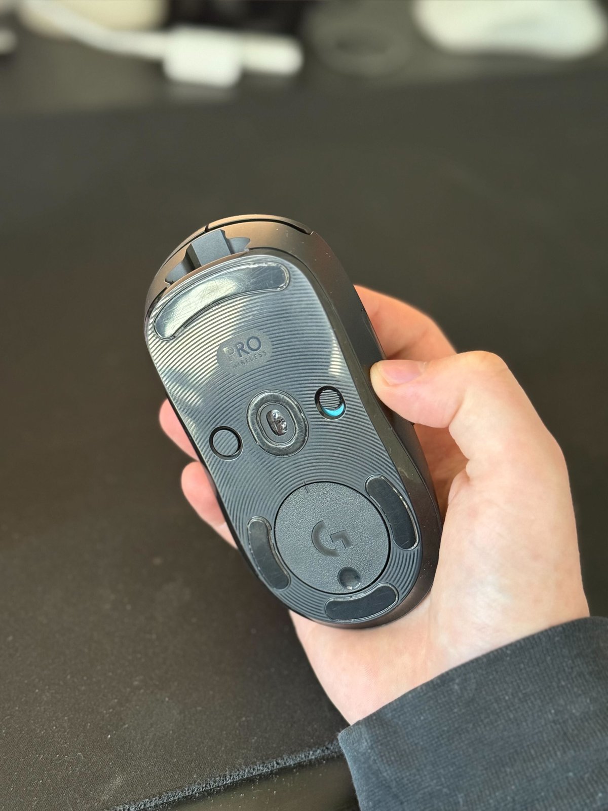 A photo showing the bottom of a Logitech GPRO Wireless mouse